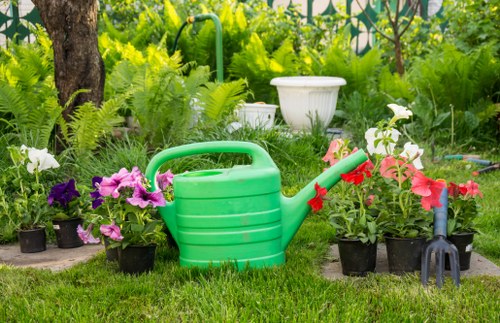 Gardener with tools inspecting a garden before work